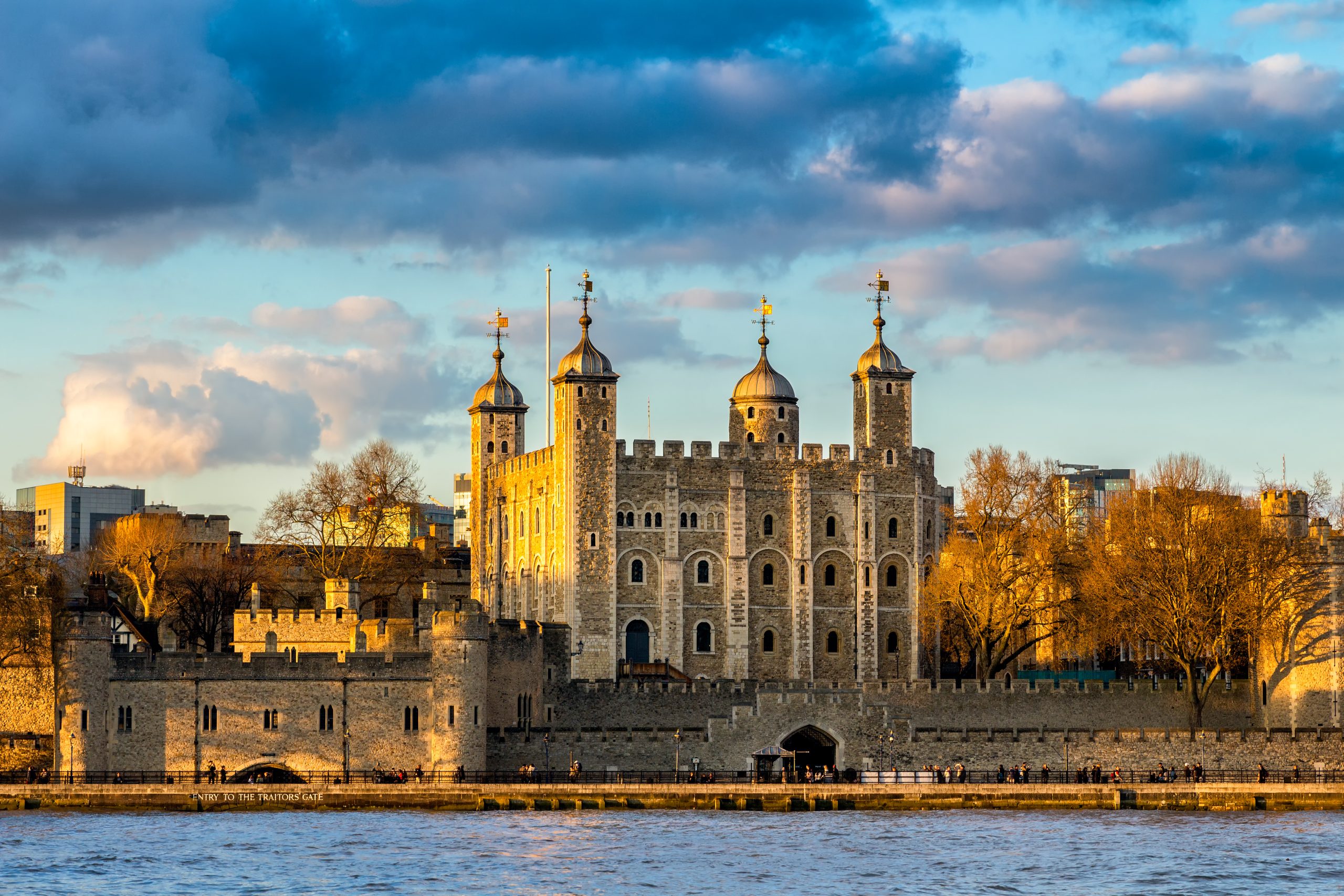 Tower of London at sunset beside the Thames, England